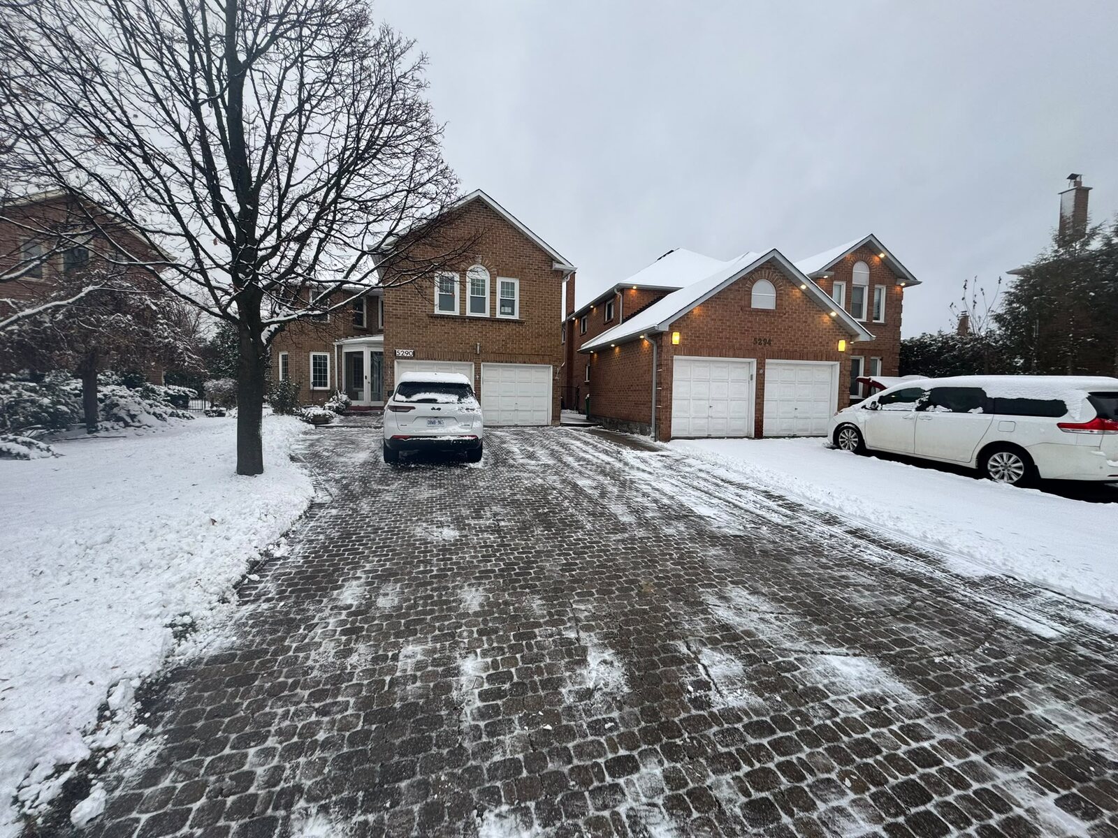 Interlocking residential driveway cleared of snow
