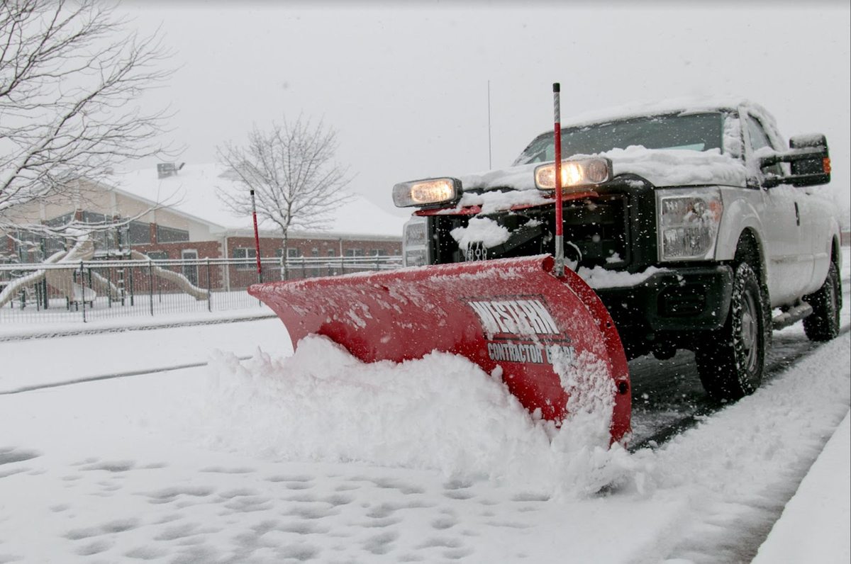 Illustrative image of pickup truck clearing snow with front plow